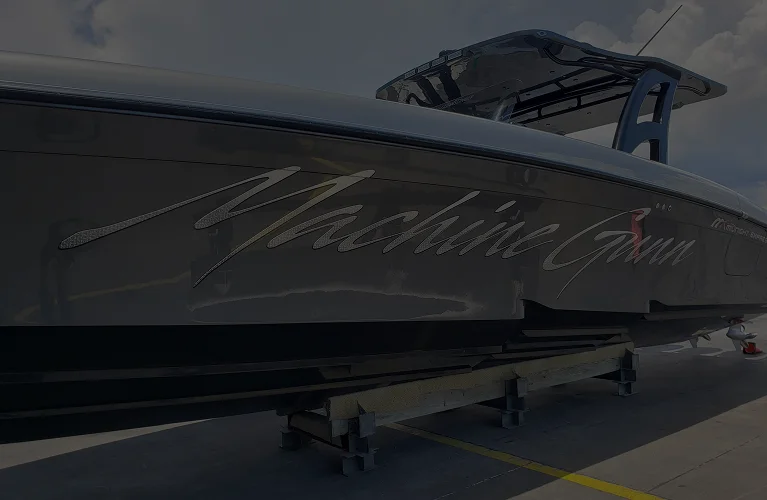 Machine Gun lettering engraved on the boat