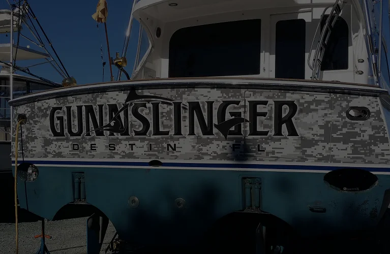 Gunslinger lettering engraved on the boat