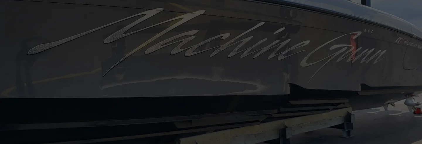 Machine Gunn lettering engraved on the boat