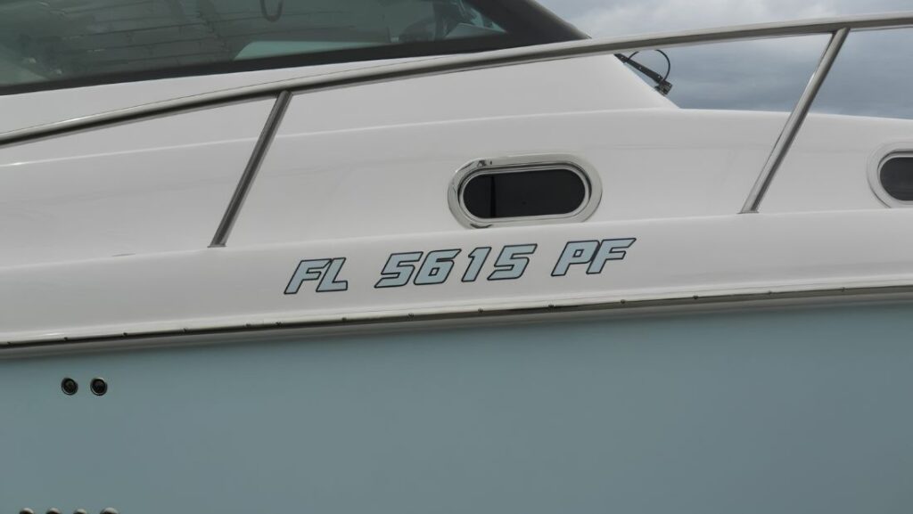 Florida boat registration number FL 5615 PF displayed in outlined lettering on a white hull.