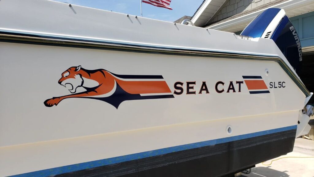 Sea Cat boat decal with orange tiger graphic and custom hull lettering