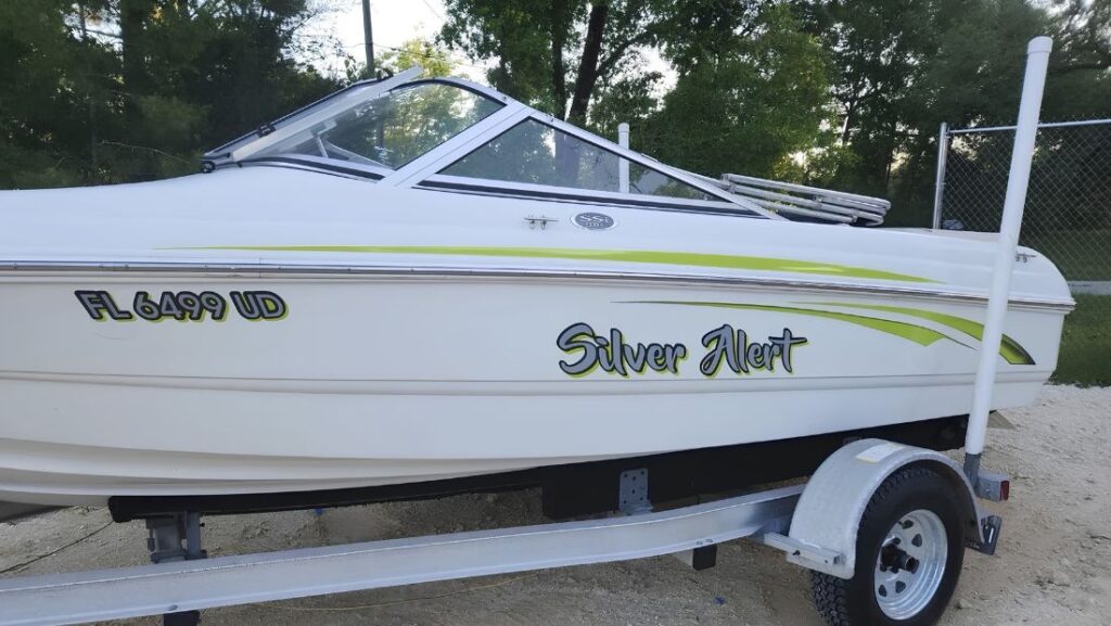 Florida boat registration number FL 6499 UD displayed on the forward hull beside the Silver Alert boat name.