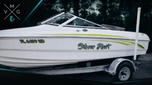 Silver Alert boat with Florida registration number FL 6499 UD and custom hull lettering by Vintage Marine Graphics.