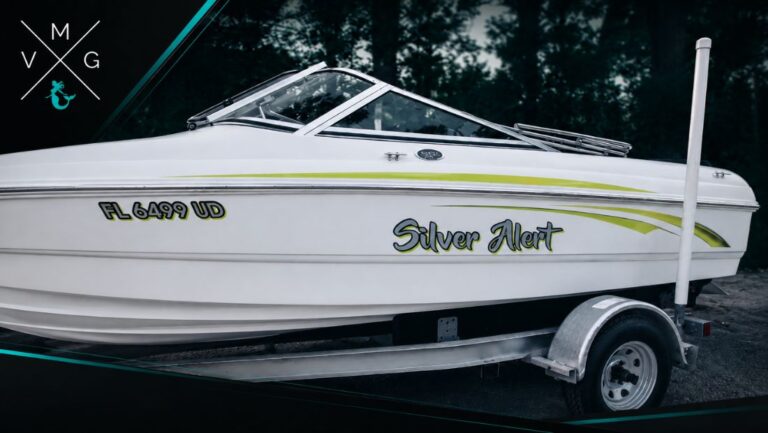 Silver Alert boat with Florida registration number FL 6499 UD and custom hull lettering by Vintage Marine Graphics.