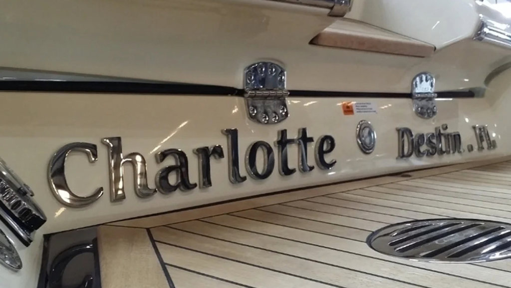 Stainless steel Charlotte boat name lettering installed on a yacht stern